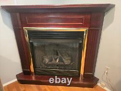 Ventless natural gas fireplace with mahogany surround and remote operation